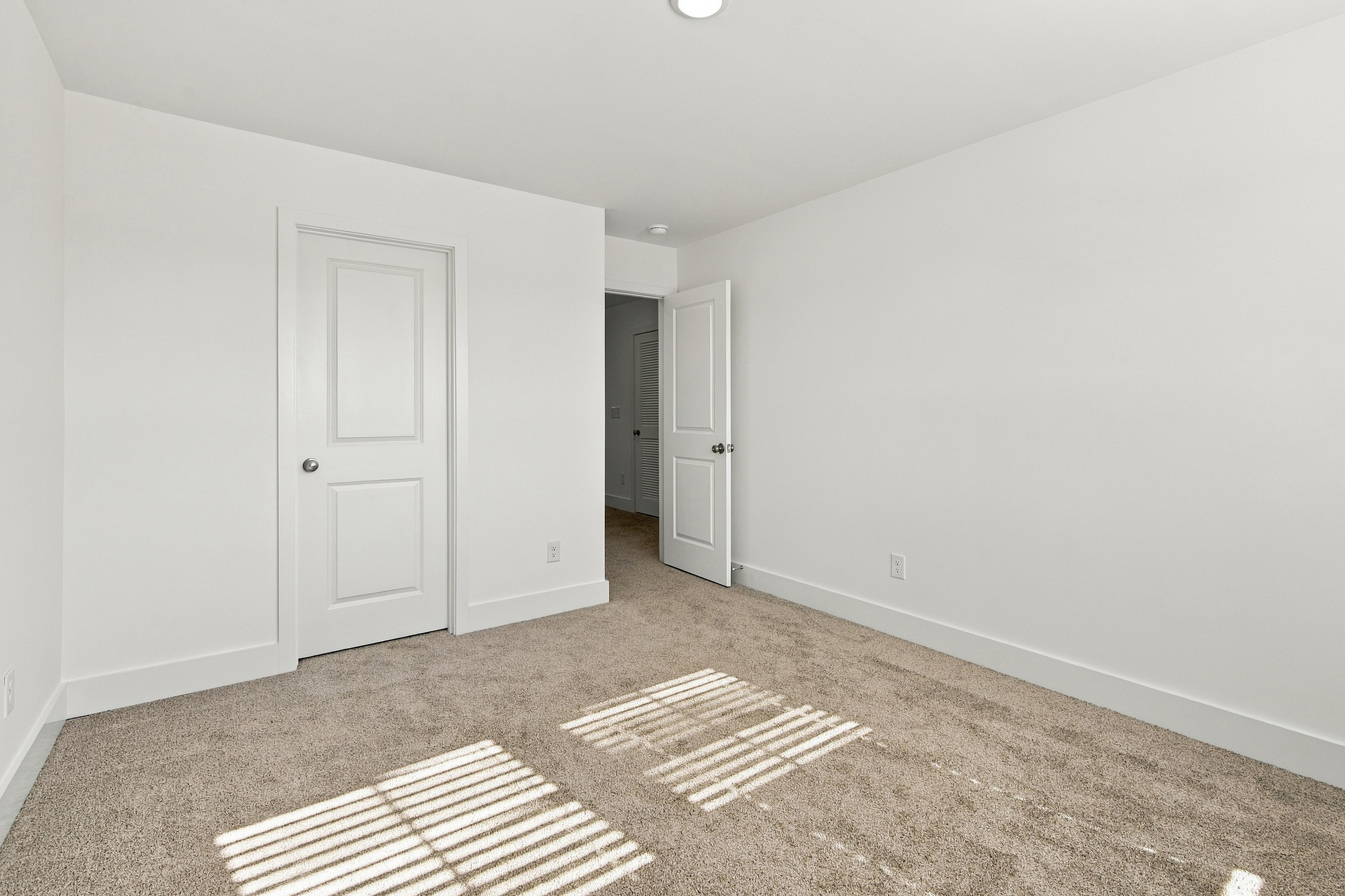 A room with white doors.