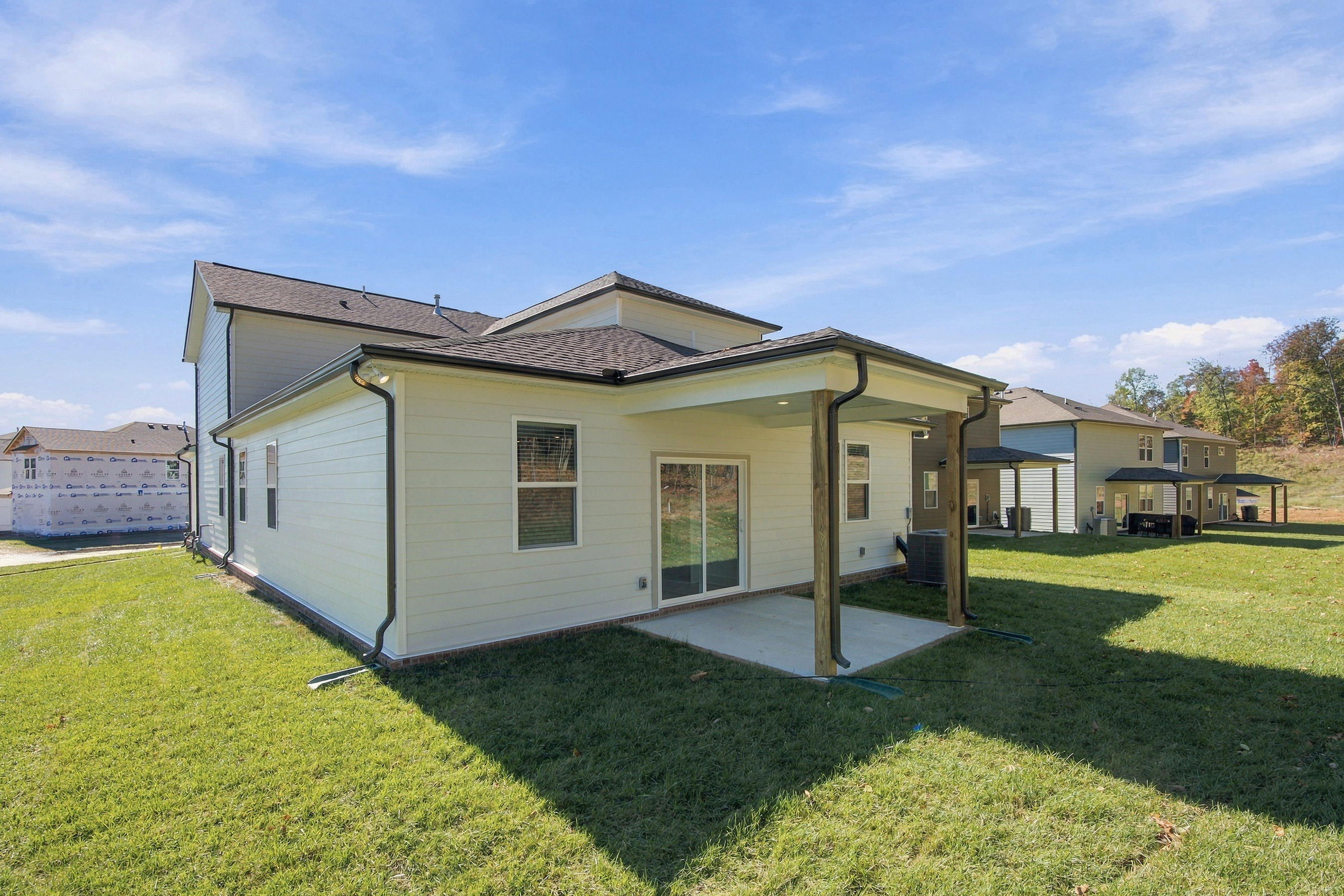 A house with a grass yard.