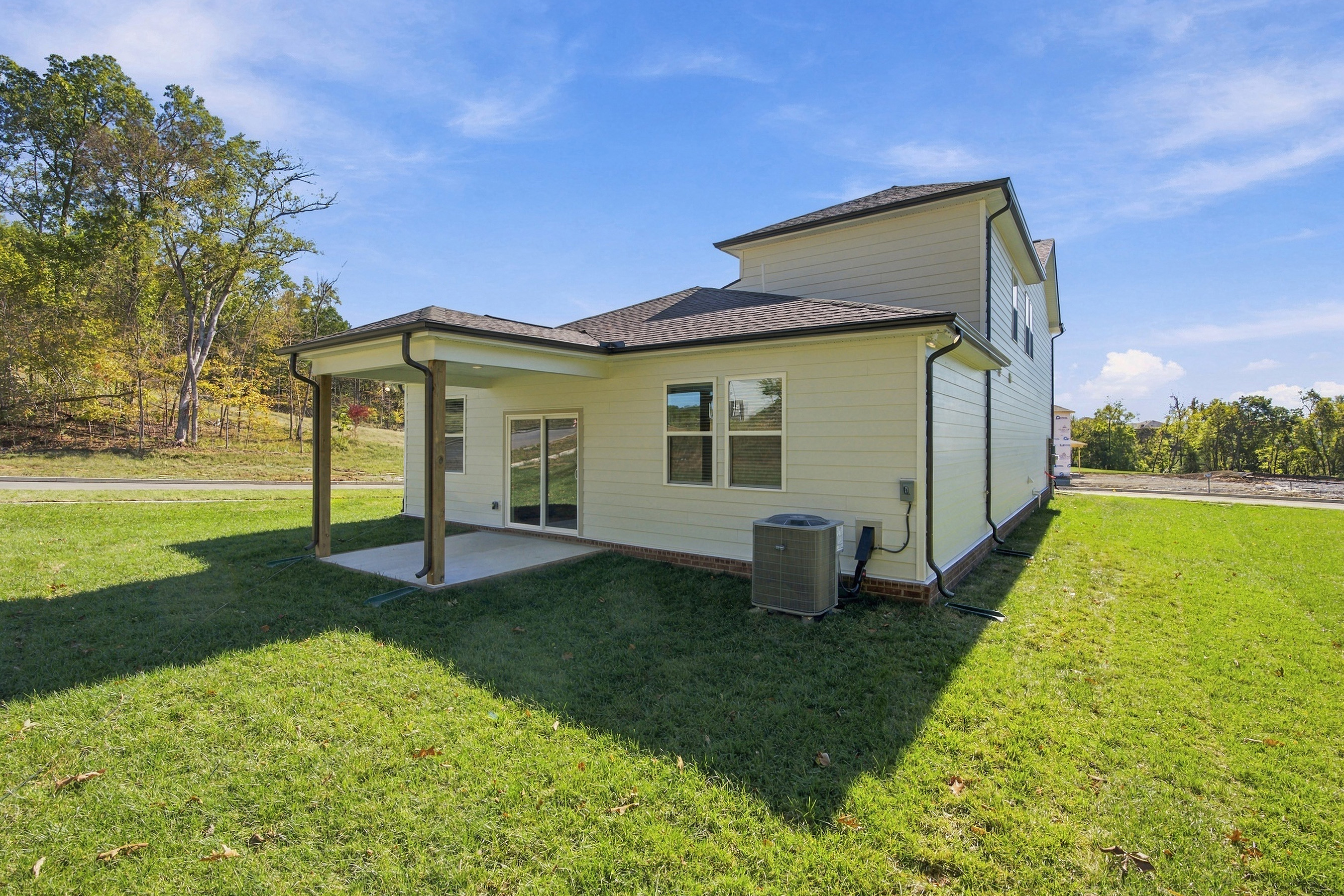 A house with a grass yard.