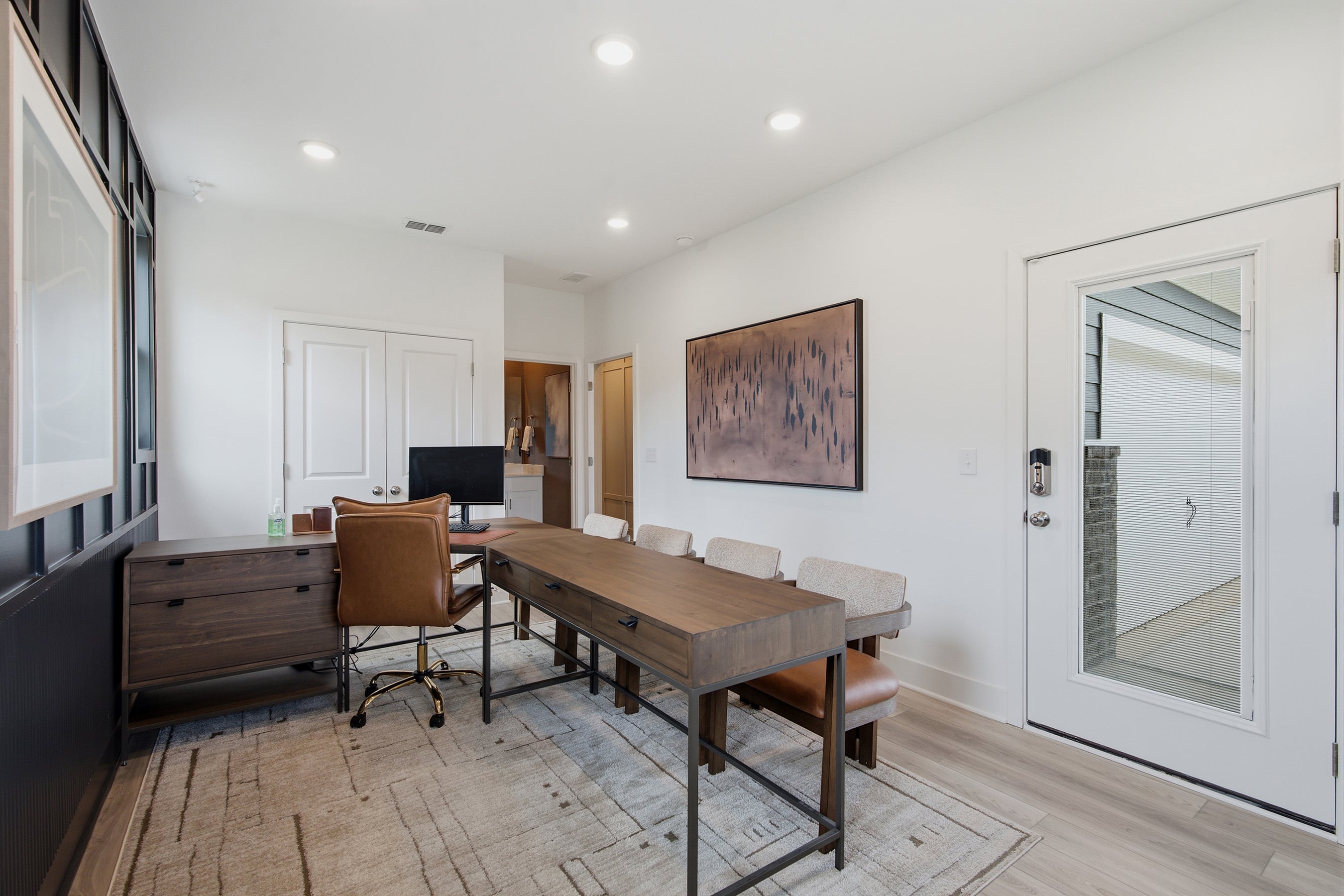 A room with a table and chairs.