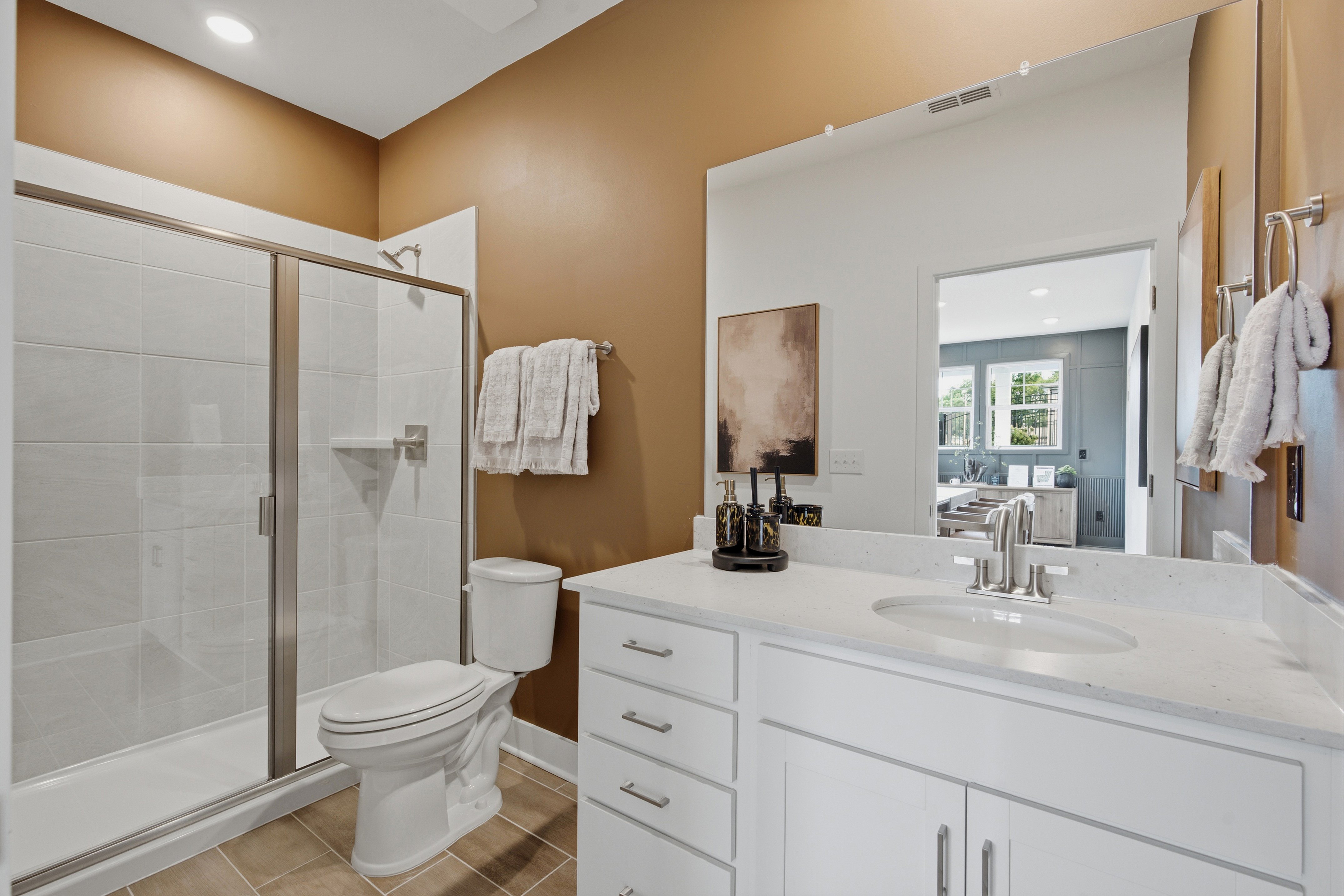 A bathroom with a glass shower.