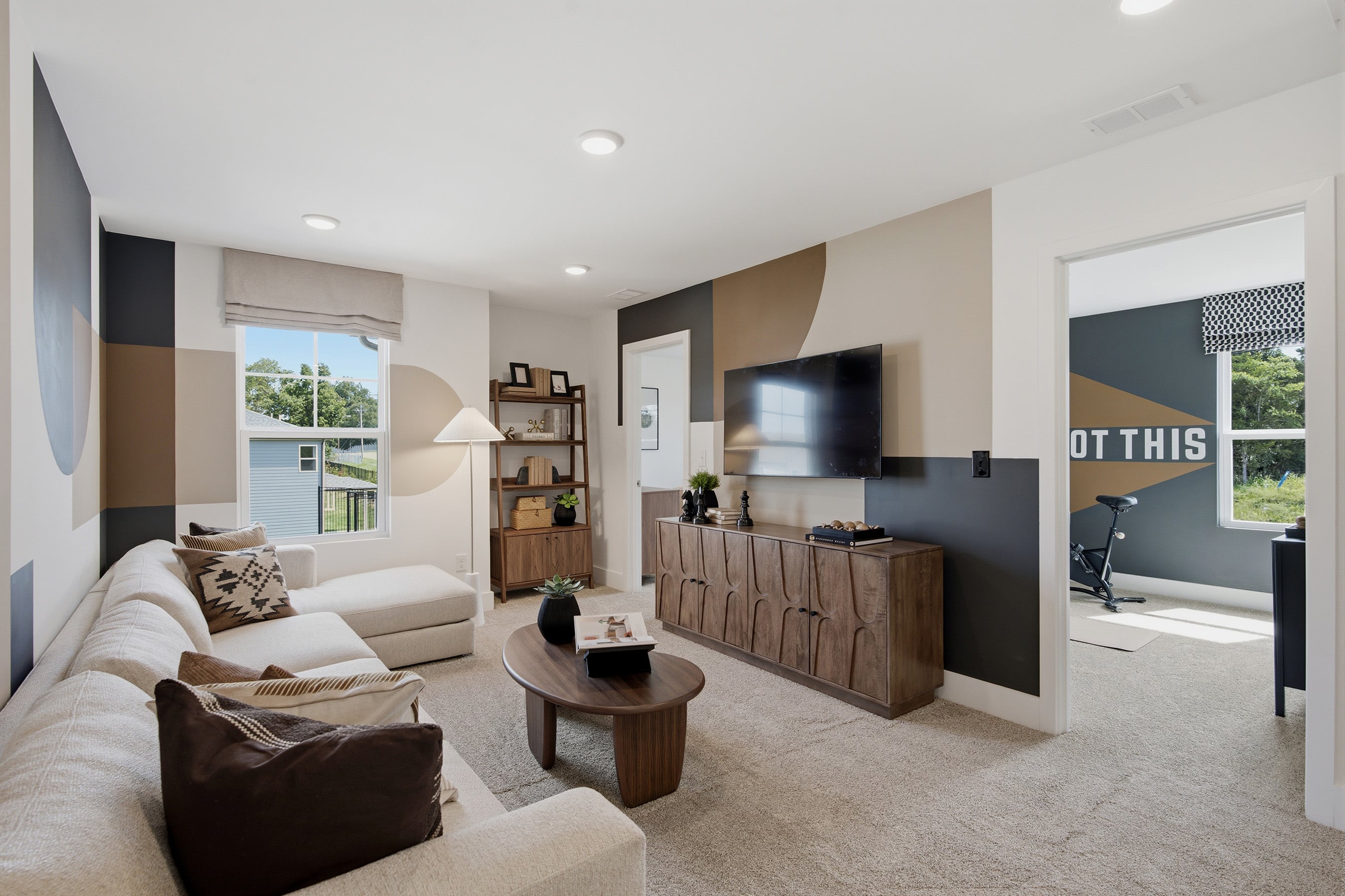 A living room with a tv and couches.