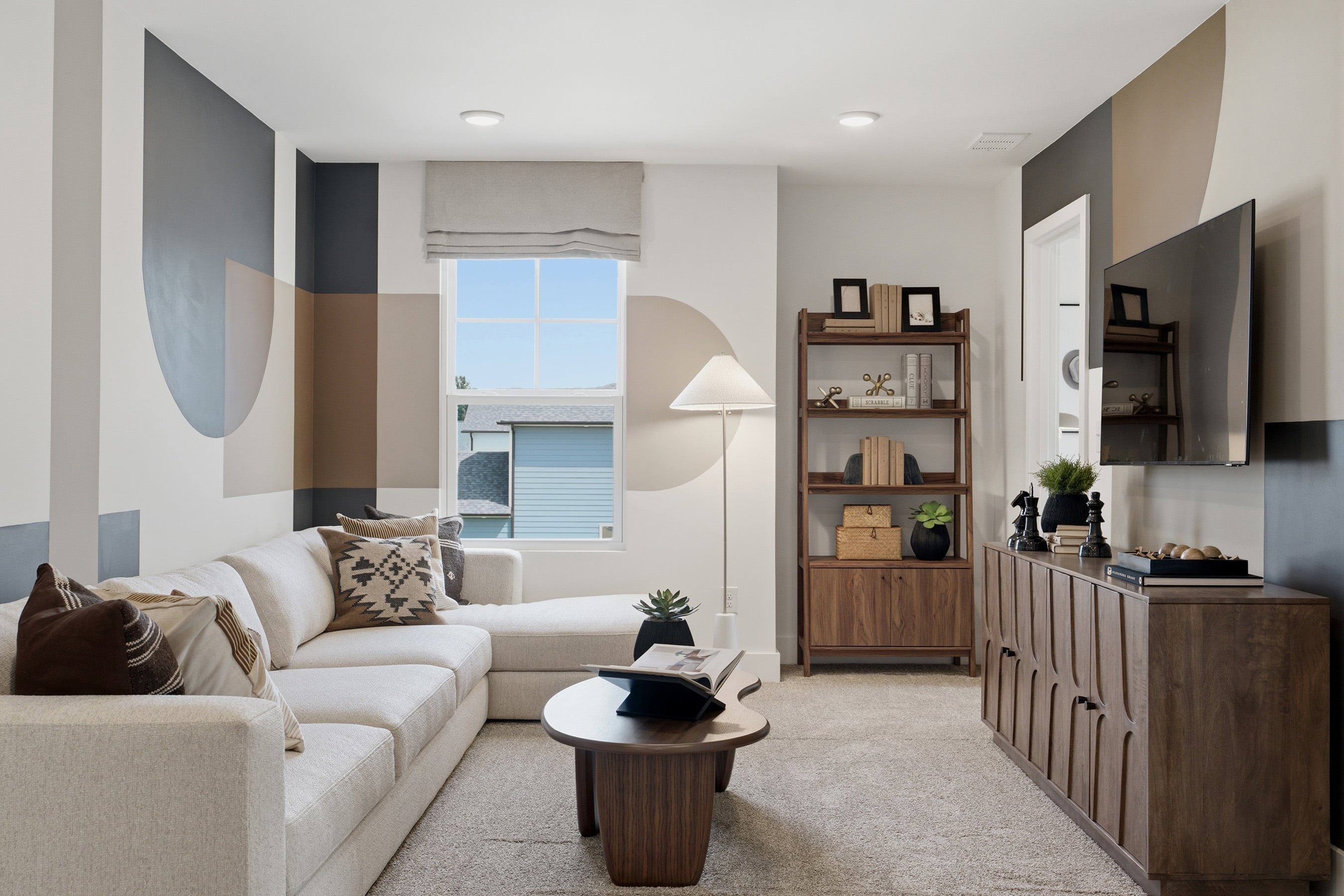 A living room with a large window.