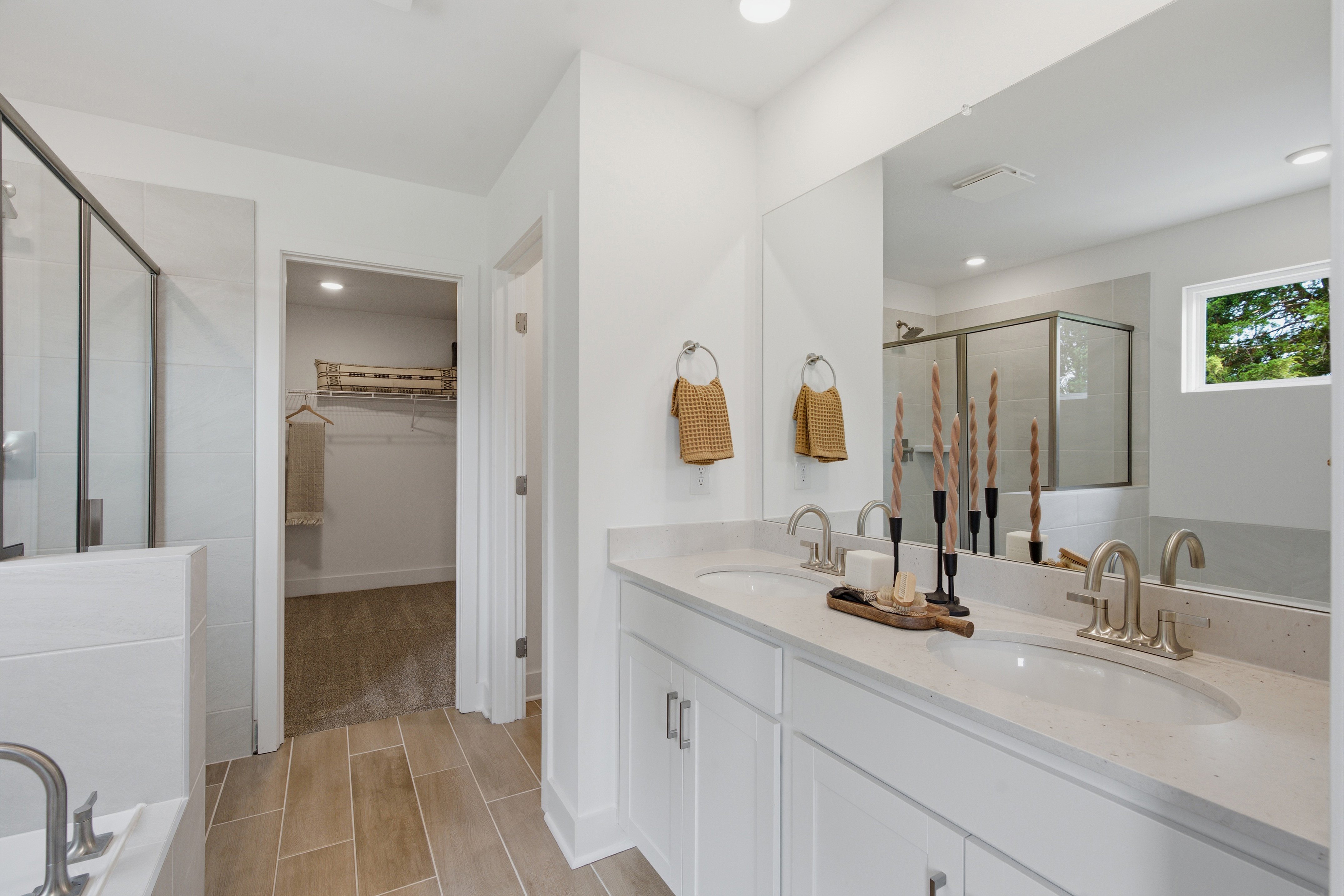 A bathroom with a large mirror.