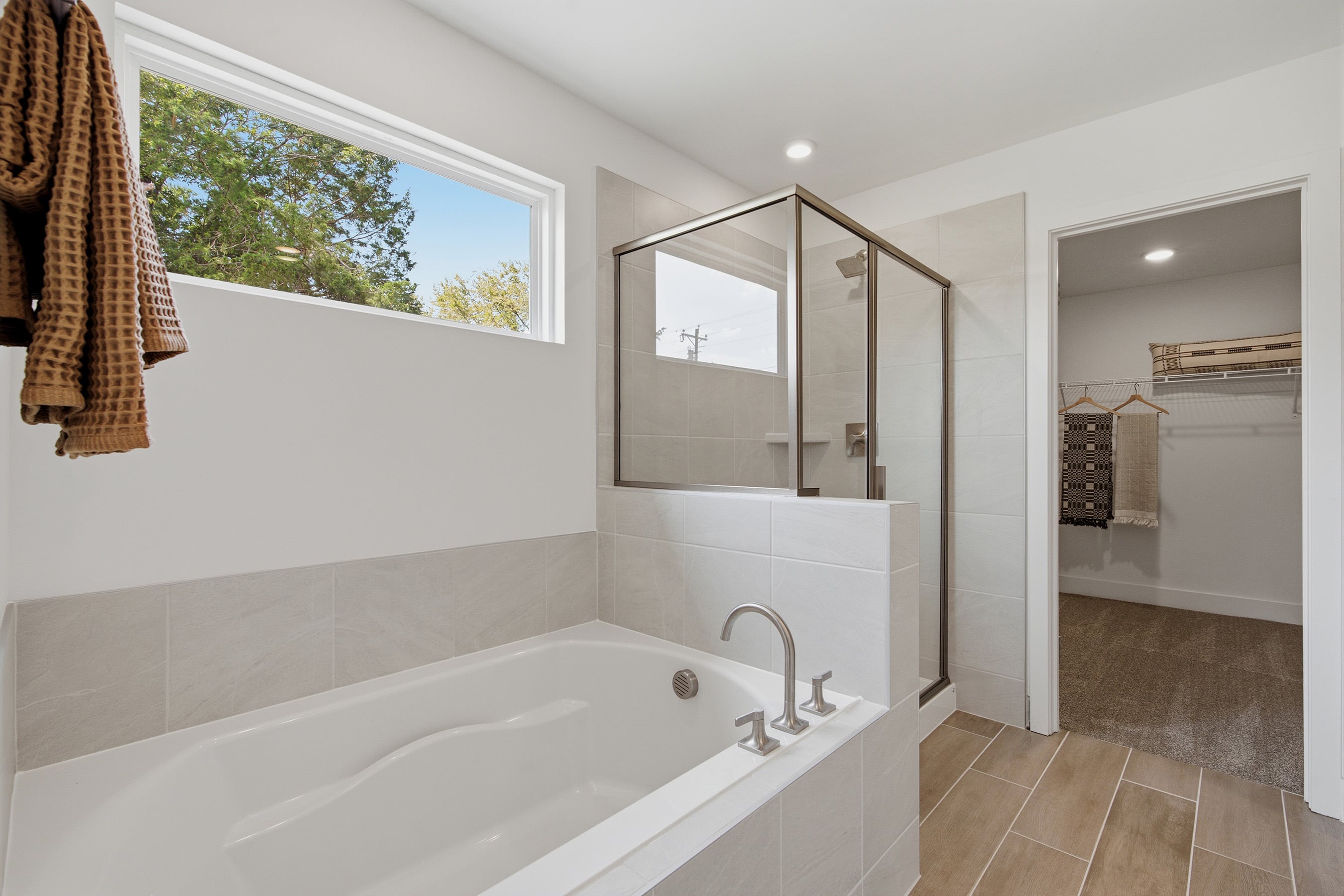 A bathroom with a tub and shower.