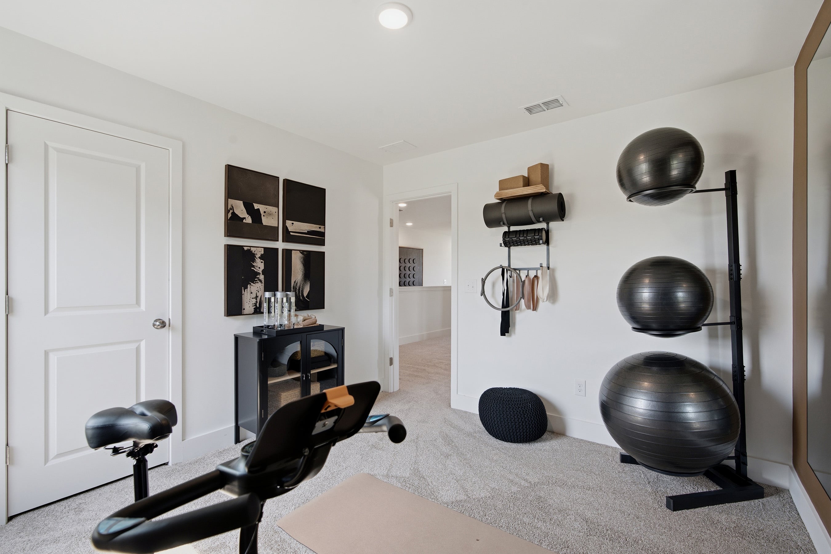 A room with a chair and a table with objects on it.