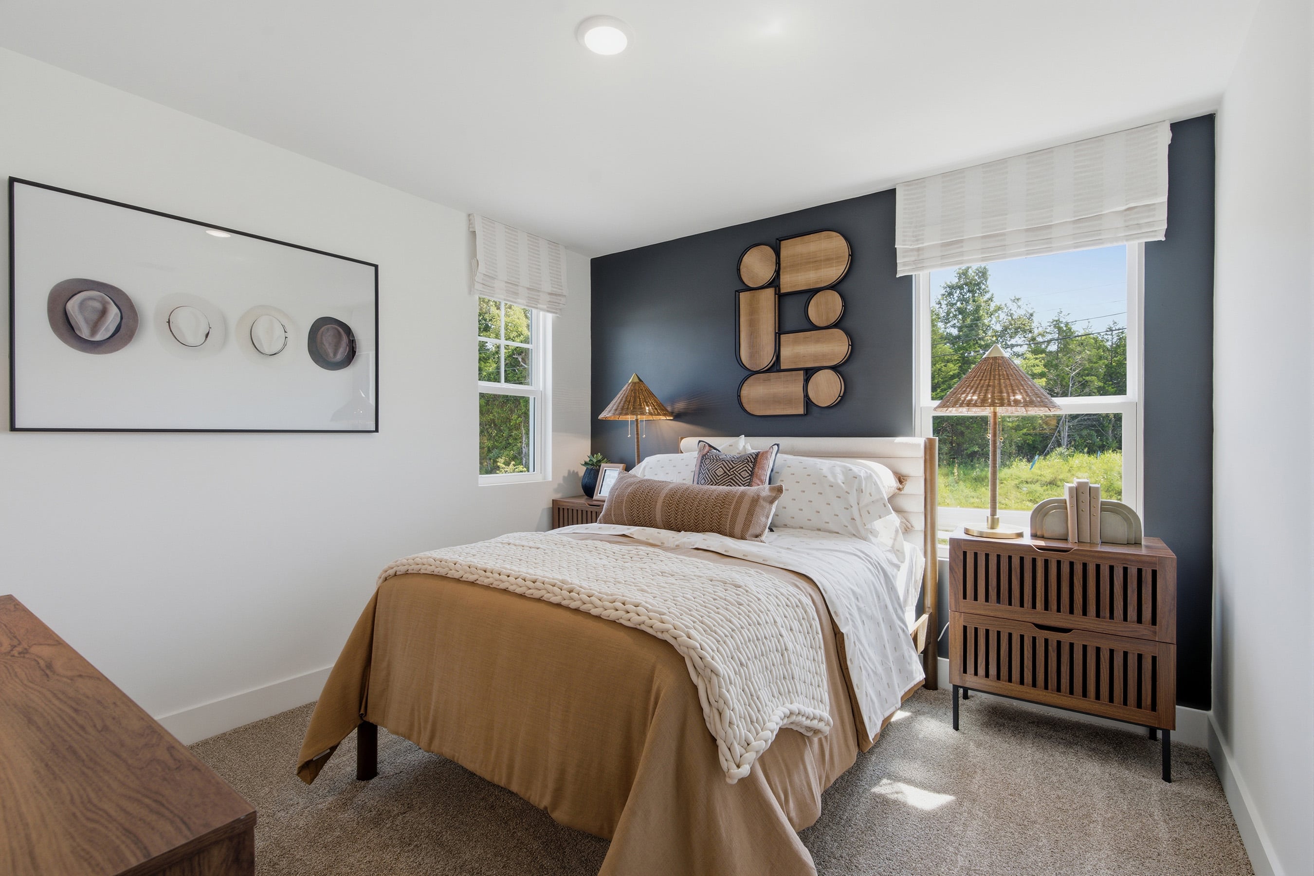 A bedroom with a bed and a window.