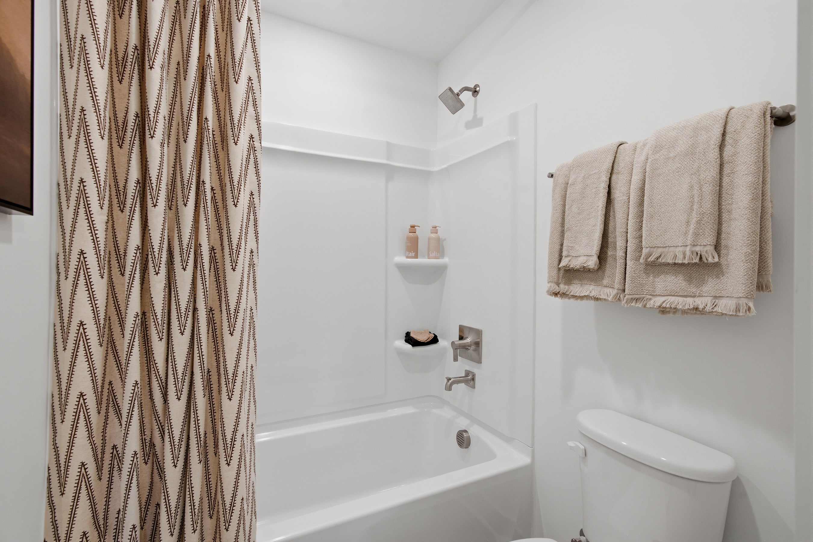 A bathroom with a shower curtain.