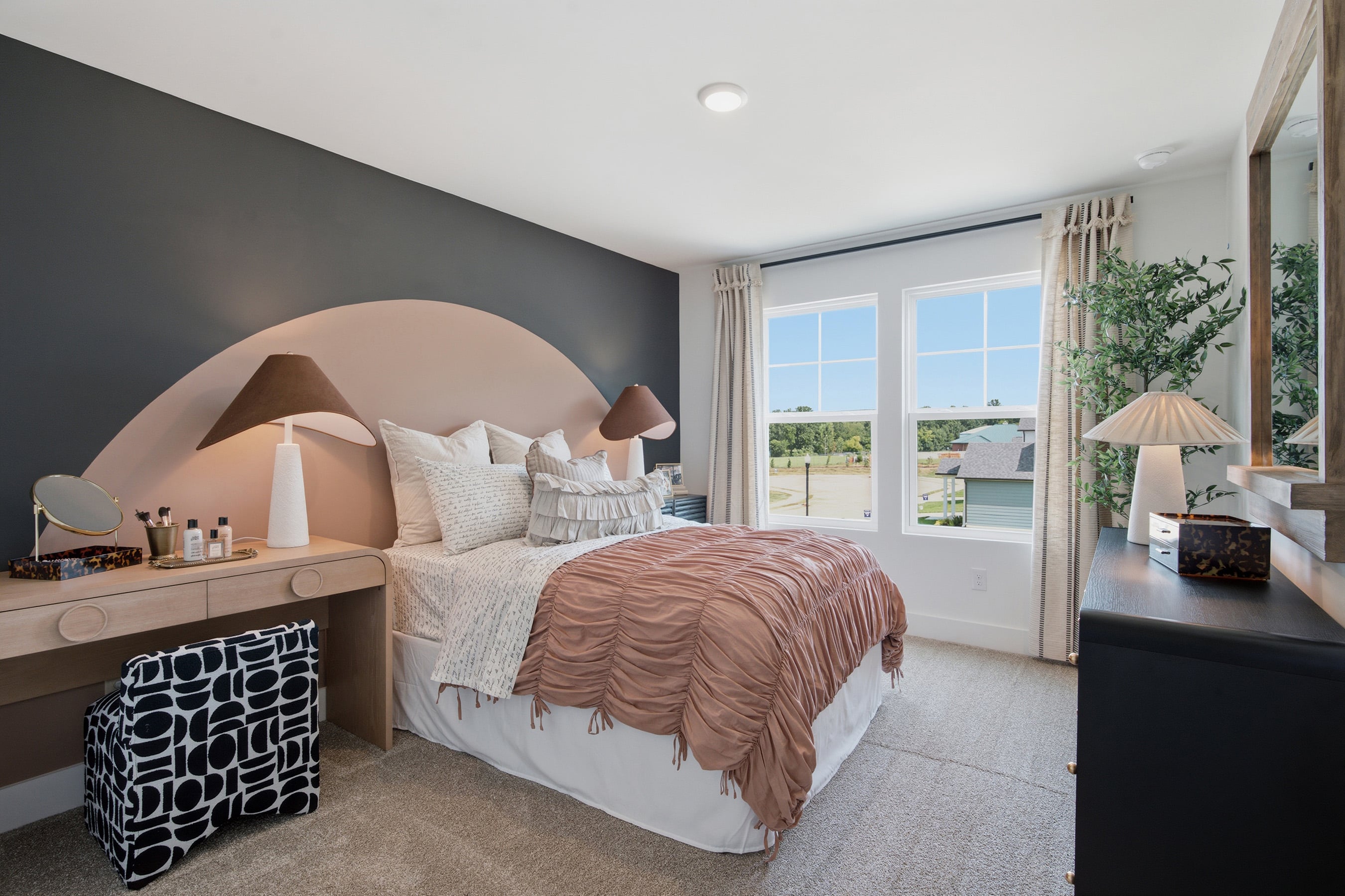 A bedroom with a large bed.