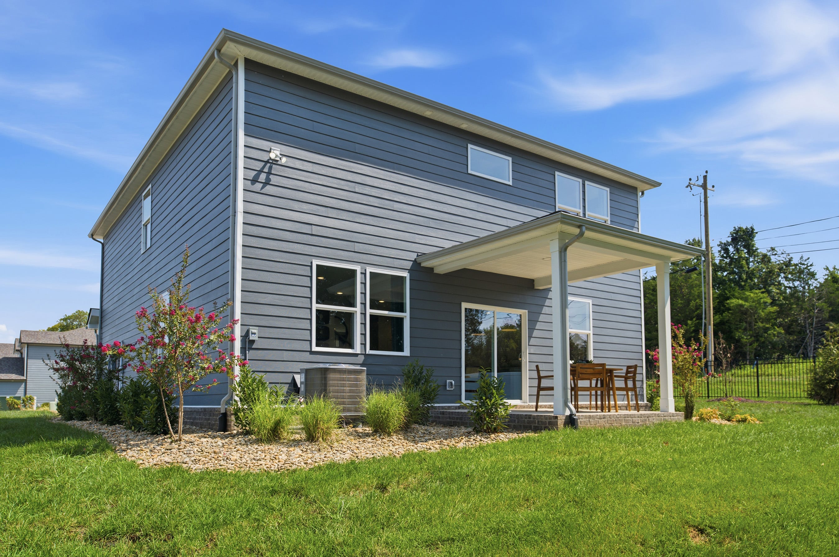 A house with a grass yard.