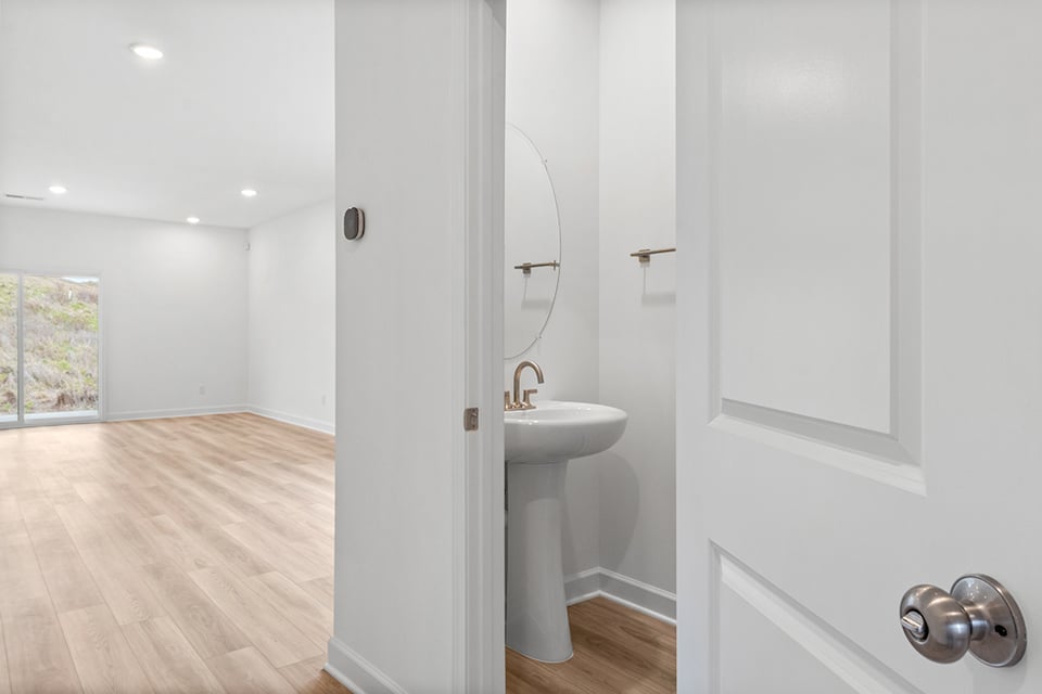 A bathroom with a sink and a mirror.