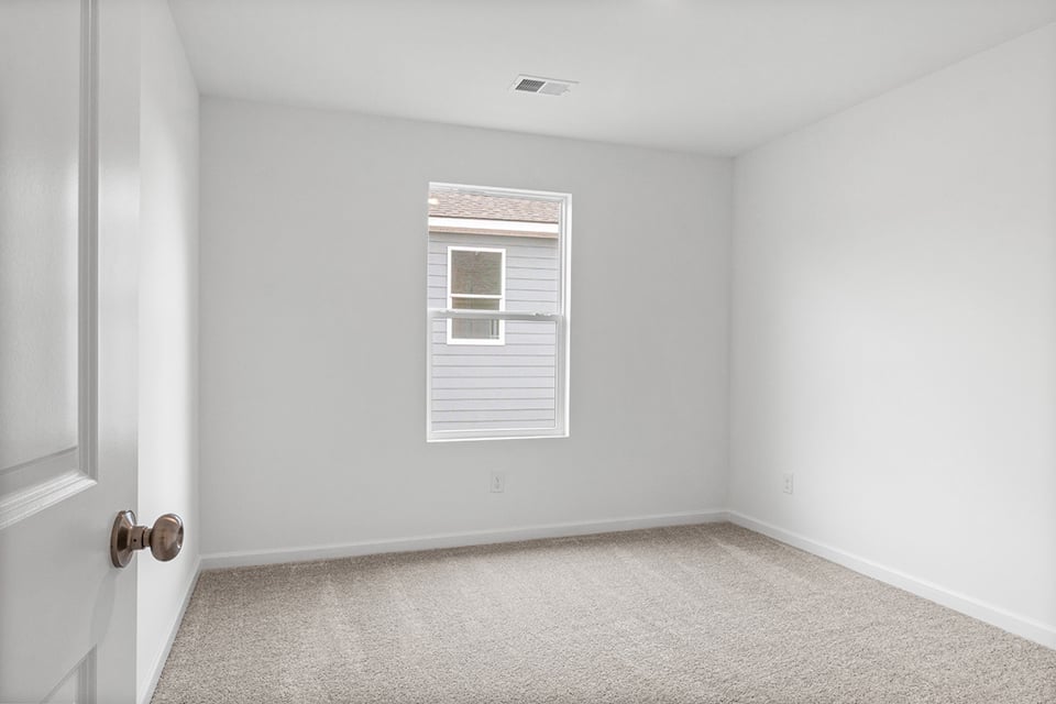 A room with a door and a window.