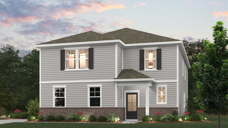 A house with a lawn in front of it.