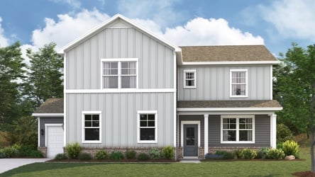 A white house with a lawn.