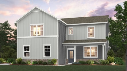 A house with a lawn in front of it.