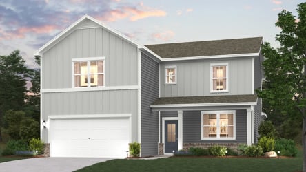 A grey house with a garage.