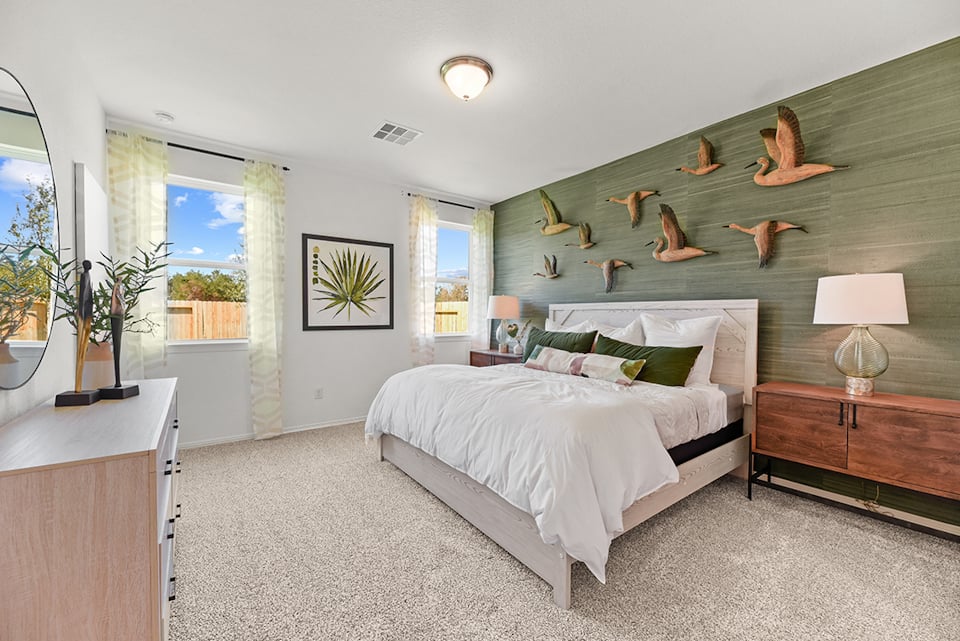 A bedroom with a large bed.