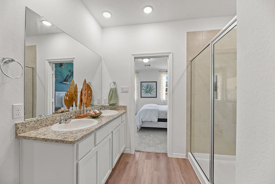 A bathroom with a glass shower.
