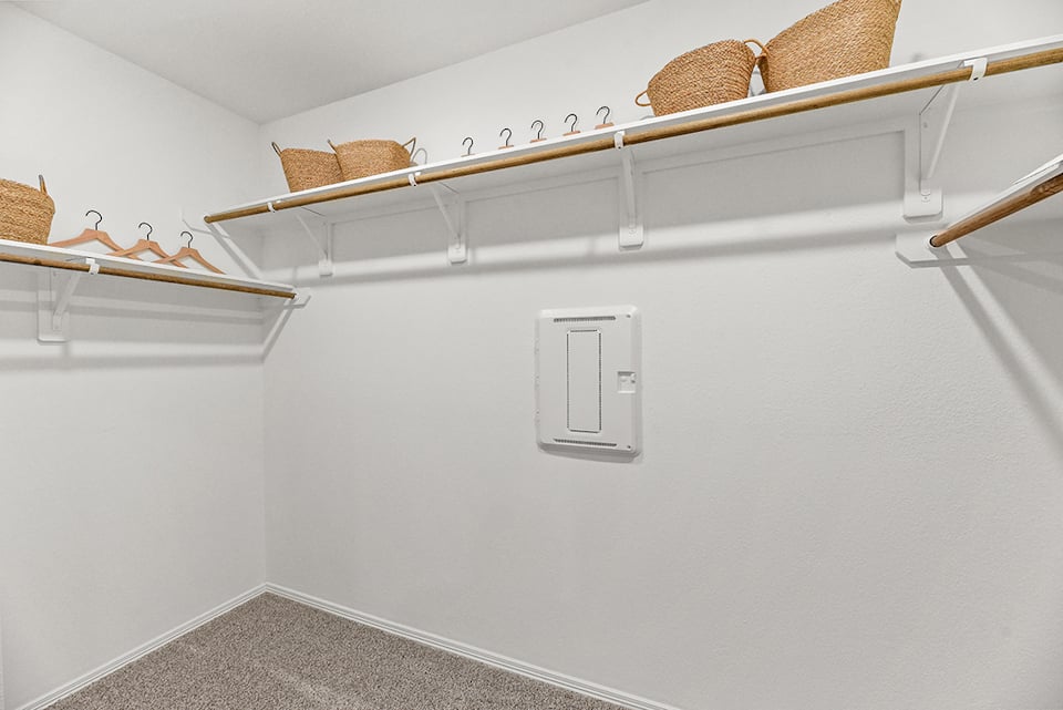 A white wall with a light fixture.