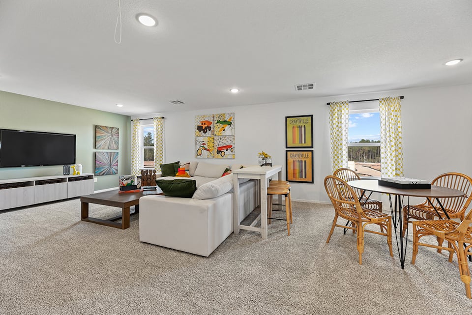 A living room with a couch and a table.