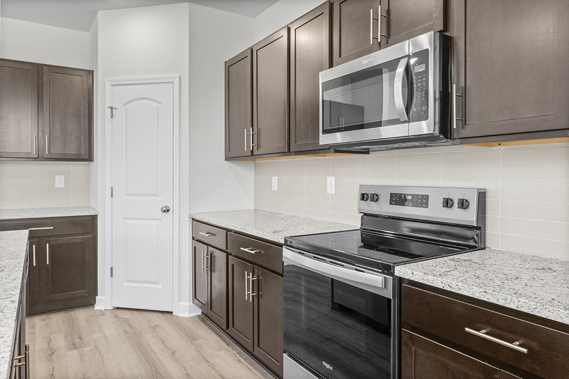 A kitchen with black appliances.
