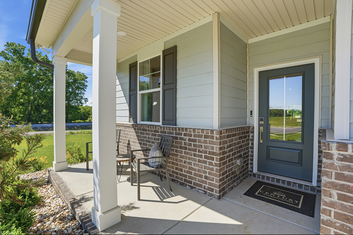A house with a patio and a door.