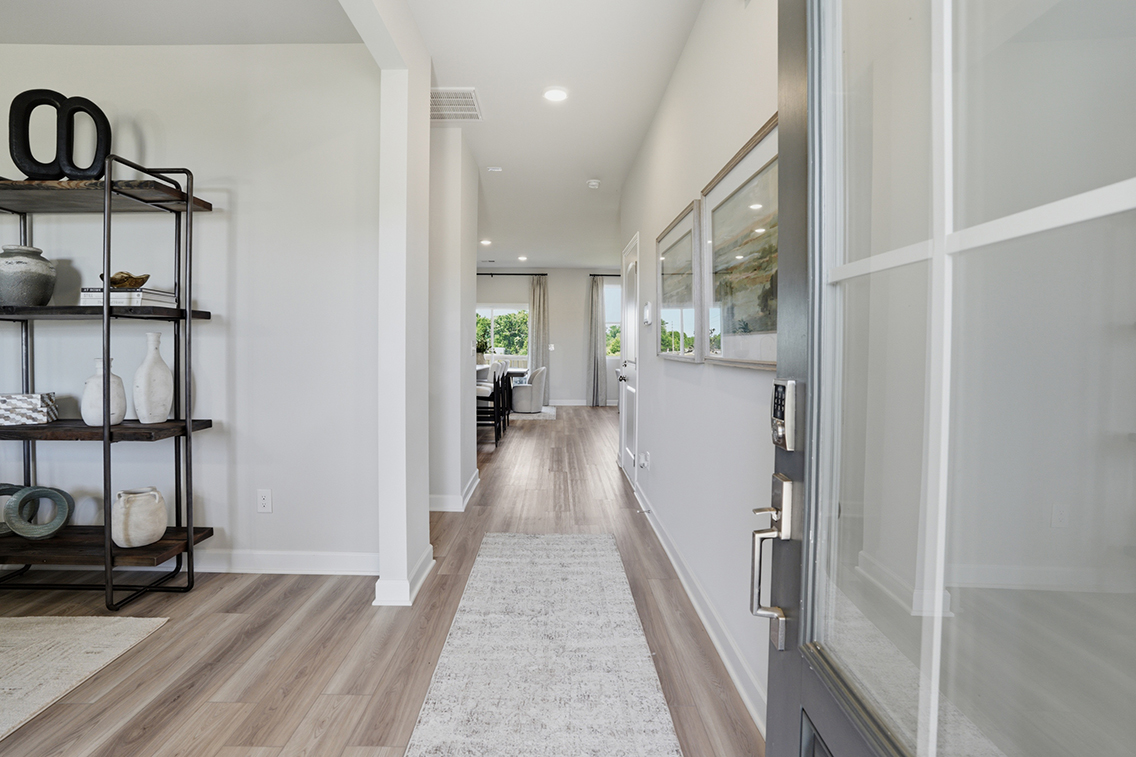 A hallway with white walls.