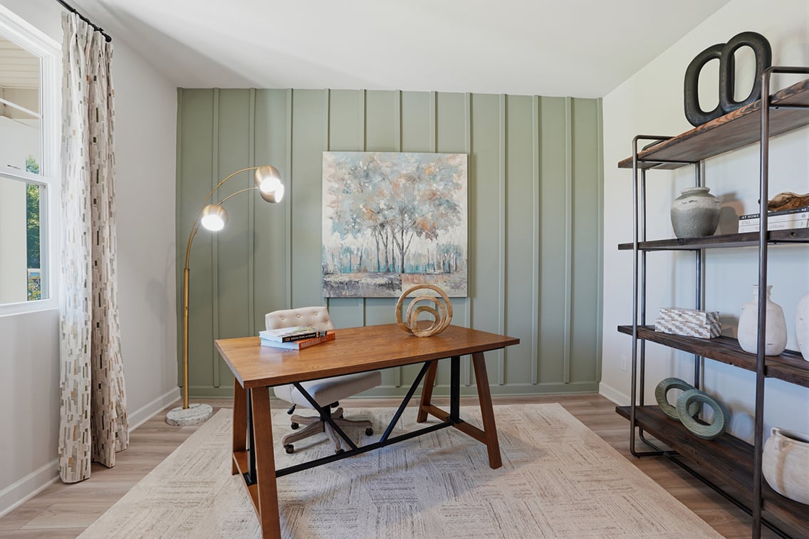 A room with a table and shelves.