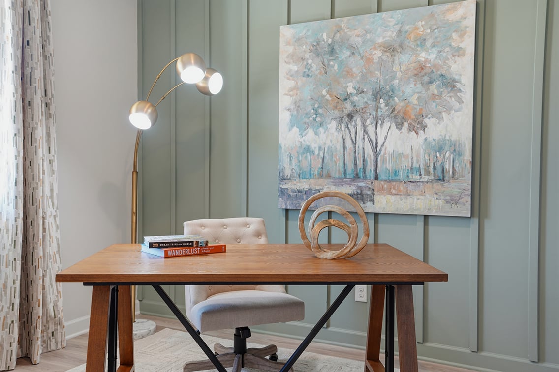 A table with books and a lamp.