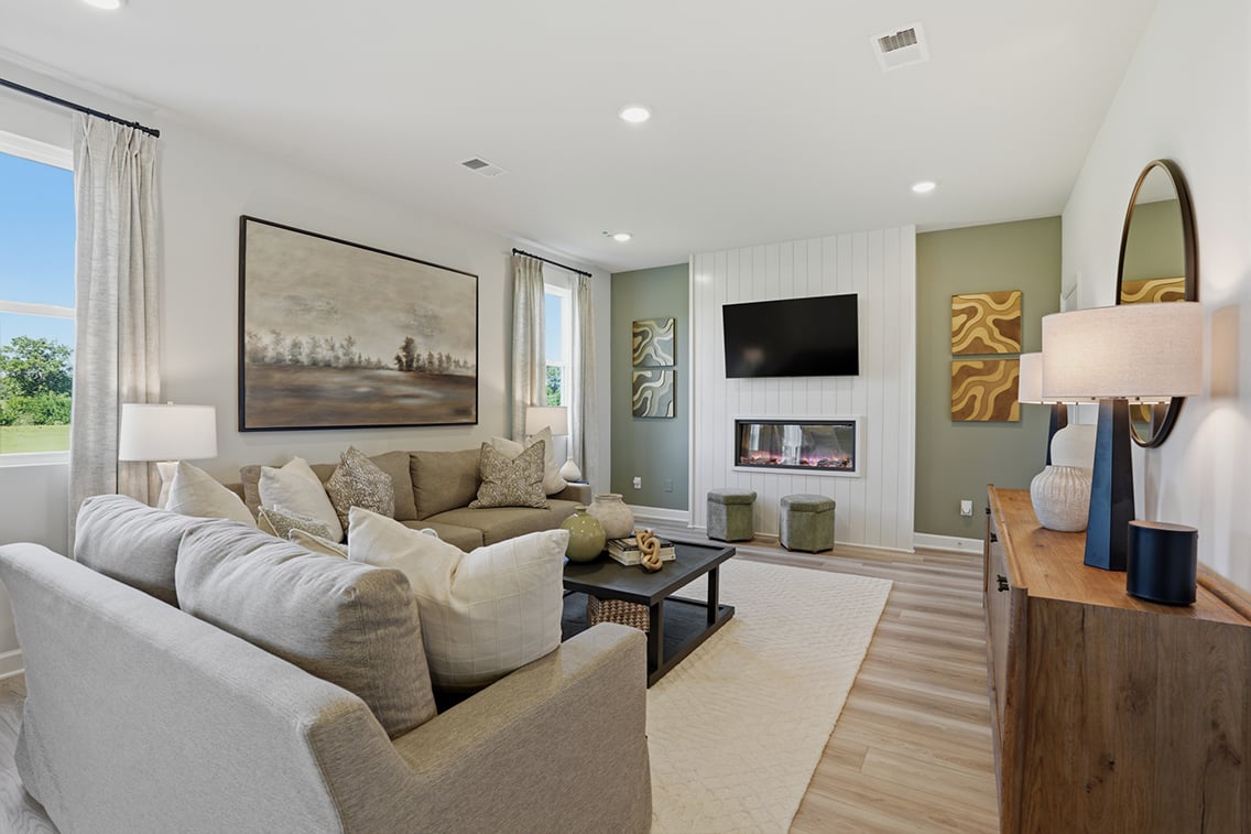 A living room with a large television.