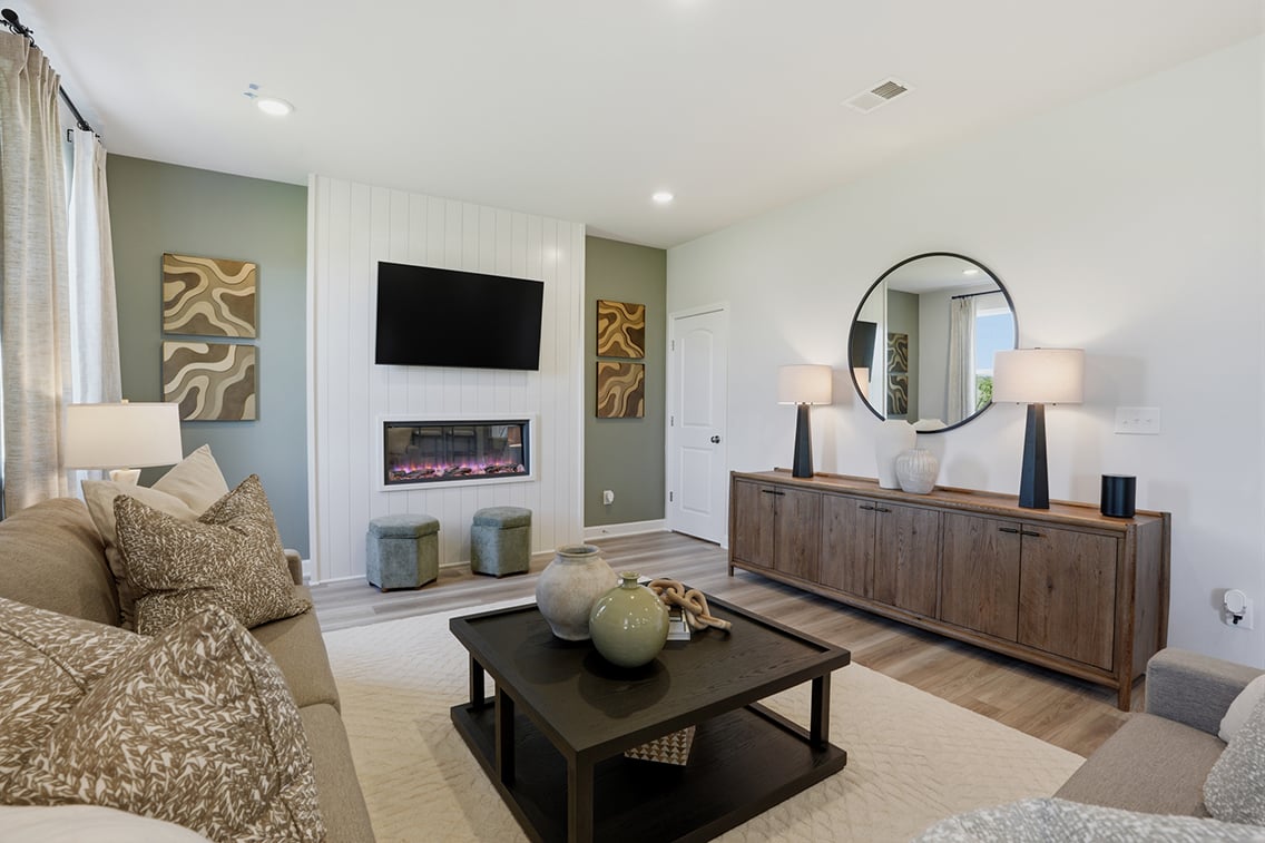 A living room with a fireplace.