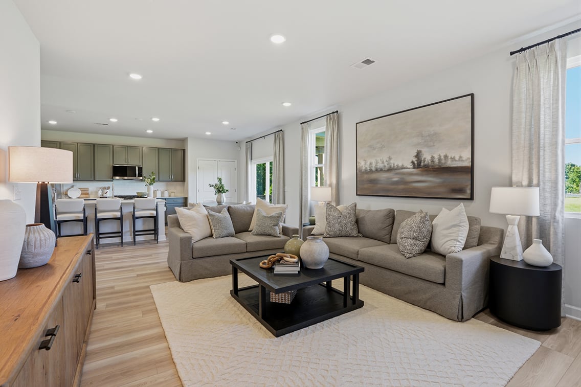 A large living room with a large couch and a coffee table.