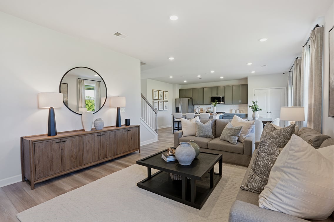 A living room with a large mirror.