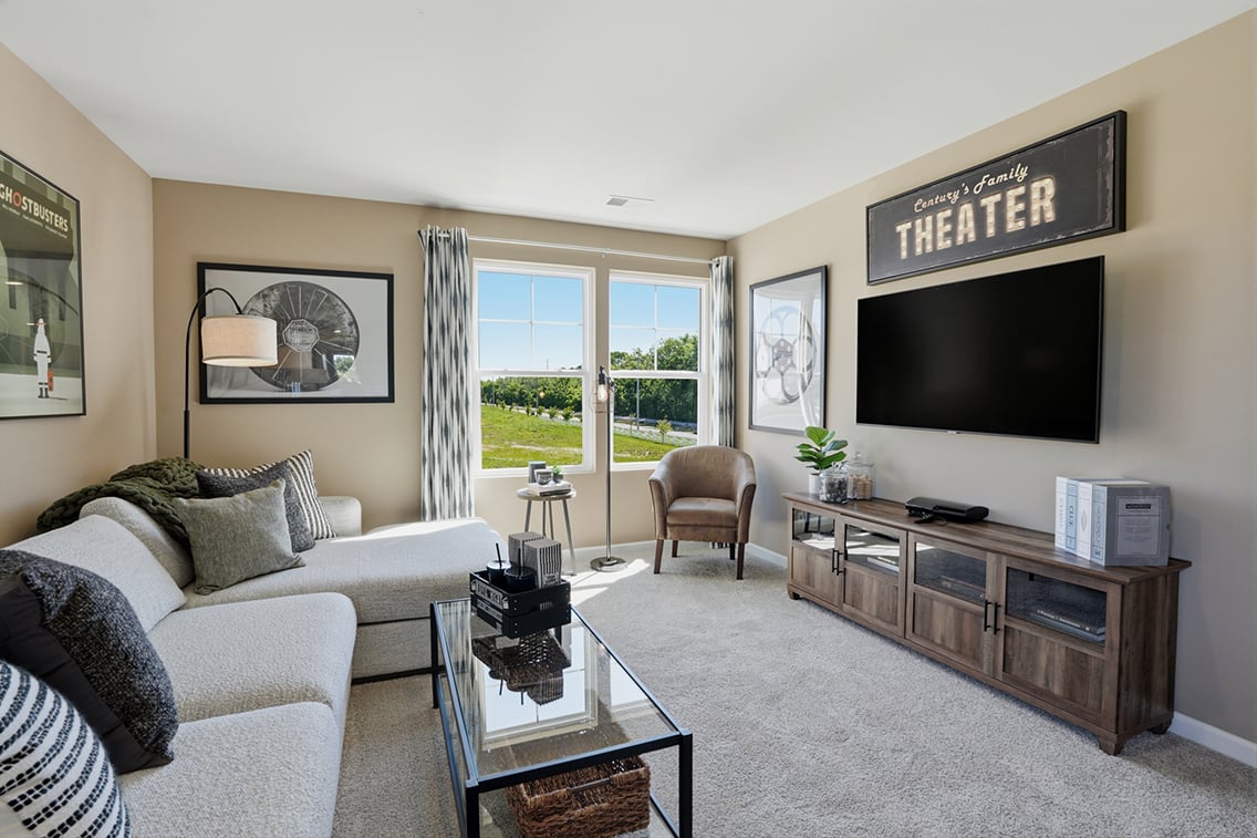 A living room with a tv and couches.