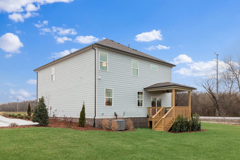 A house with a yard and a fence.