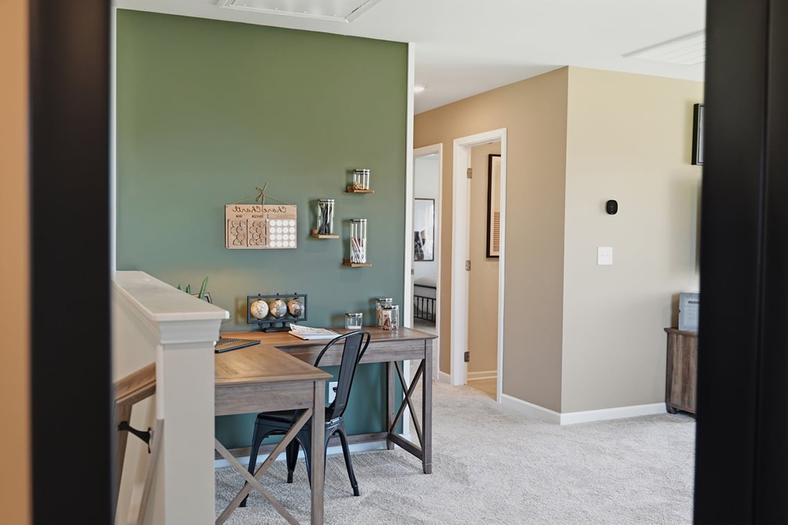 A room with a desk and a chair.