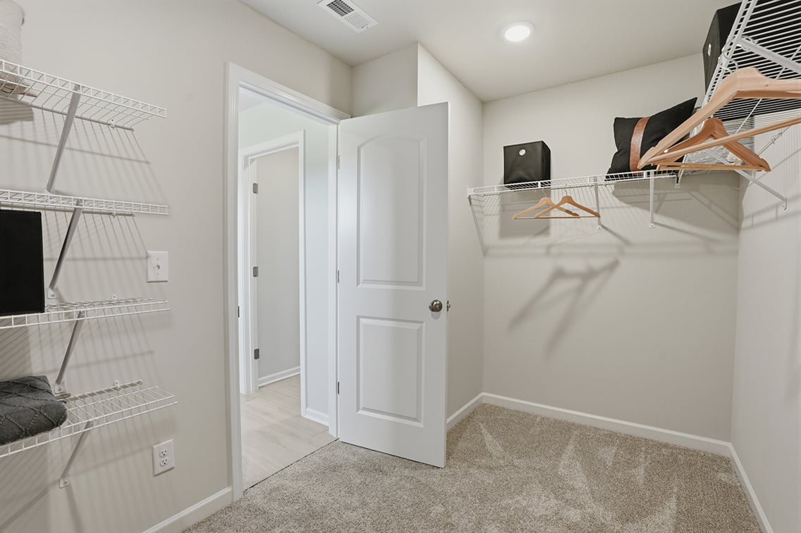 A room with a bed and a tv.