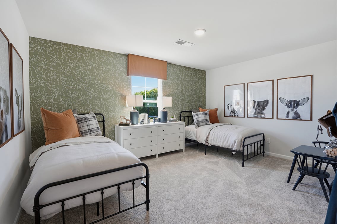 A bedroom with two beds.