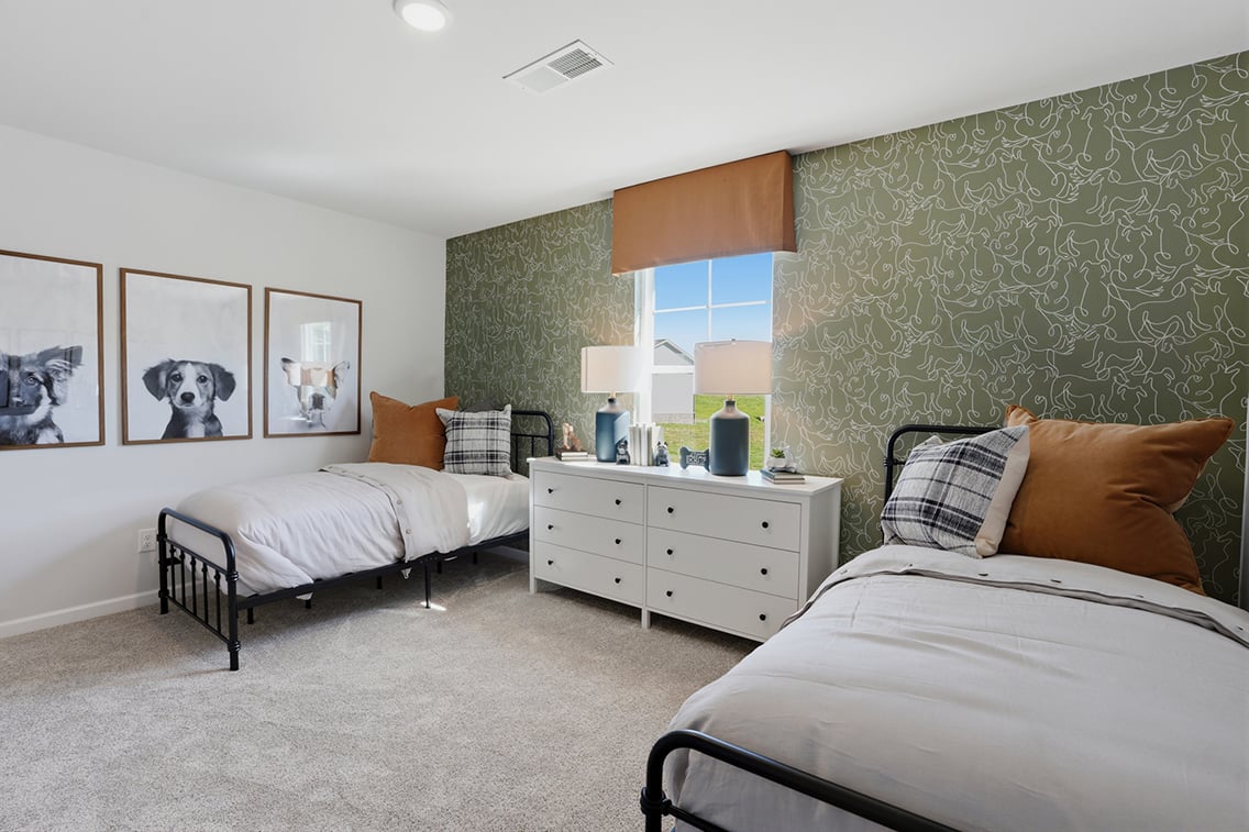 A bedroom with two beds.