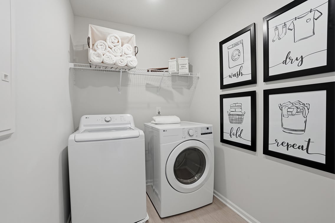A washer and dryer in a room.