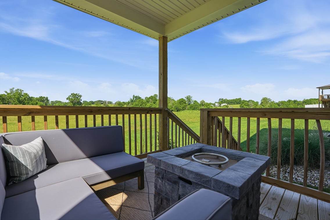 A deck with a table and chairs.