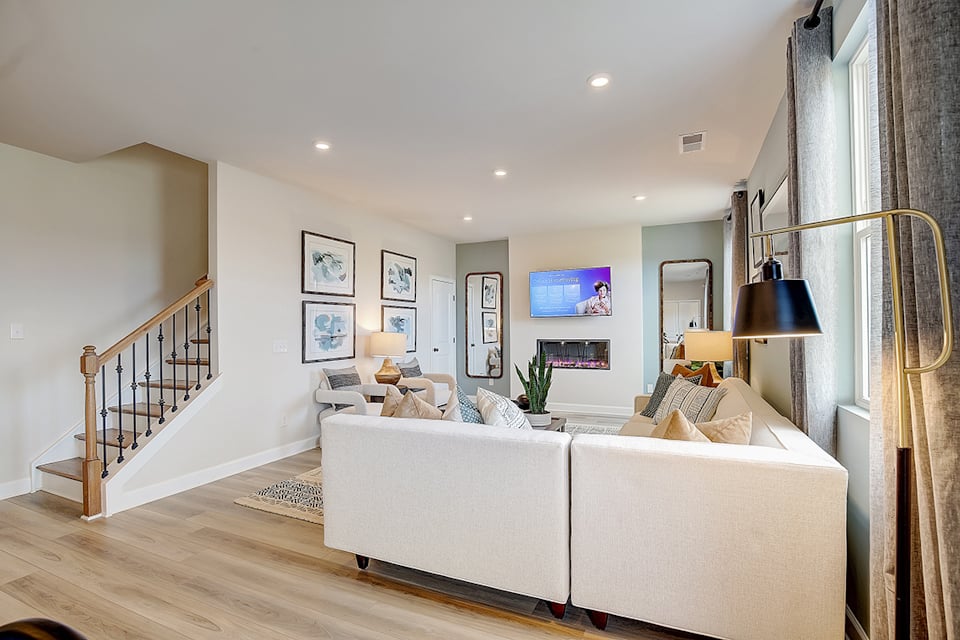 A living room with a white couch.