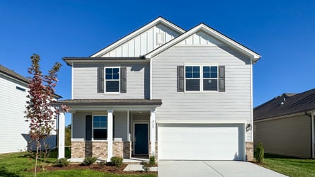 A white house with a garage.