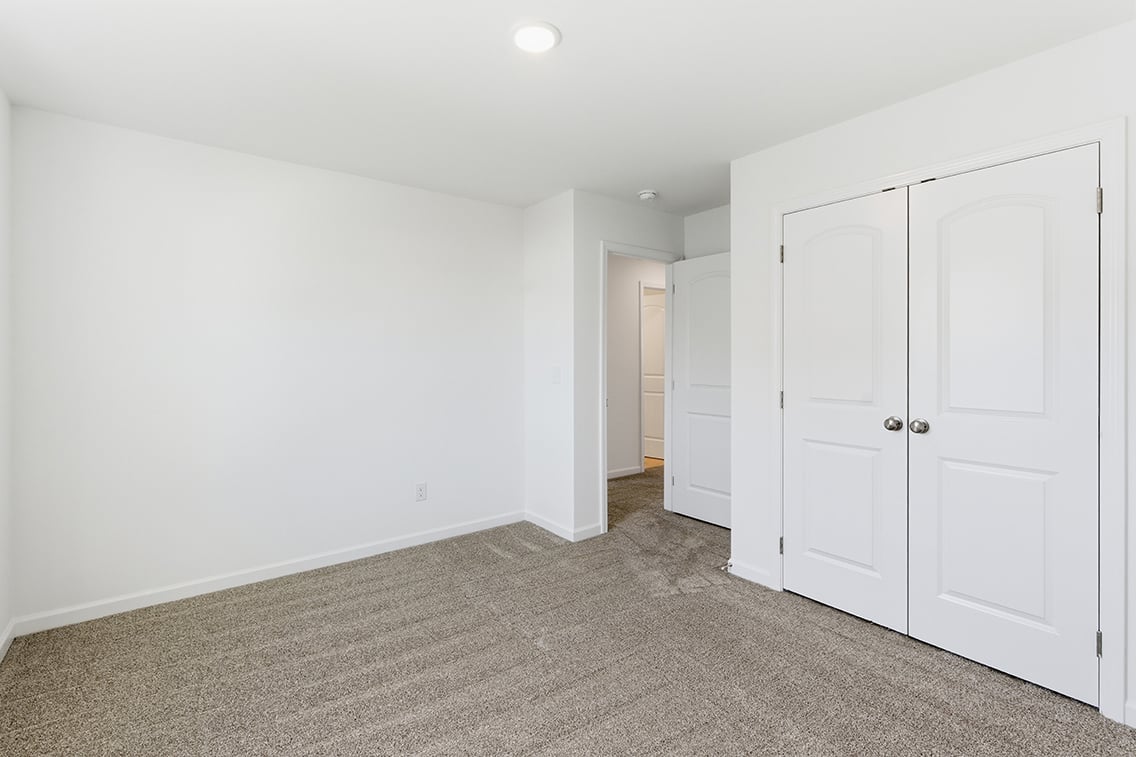 A room with white doors.