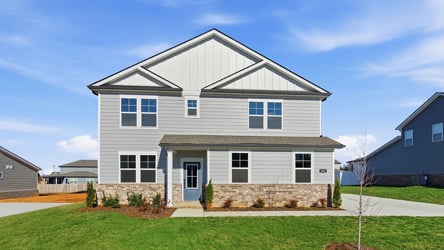 A house with a lawn in front.