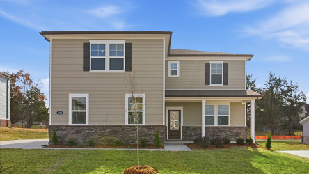 A house with a large front yard.