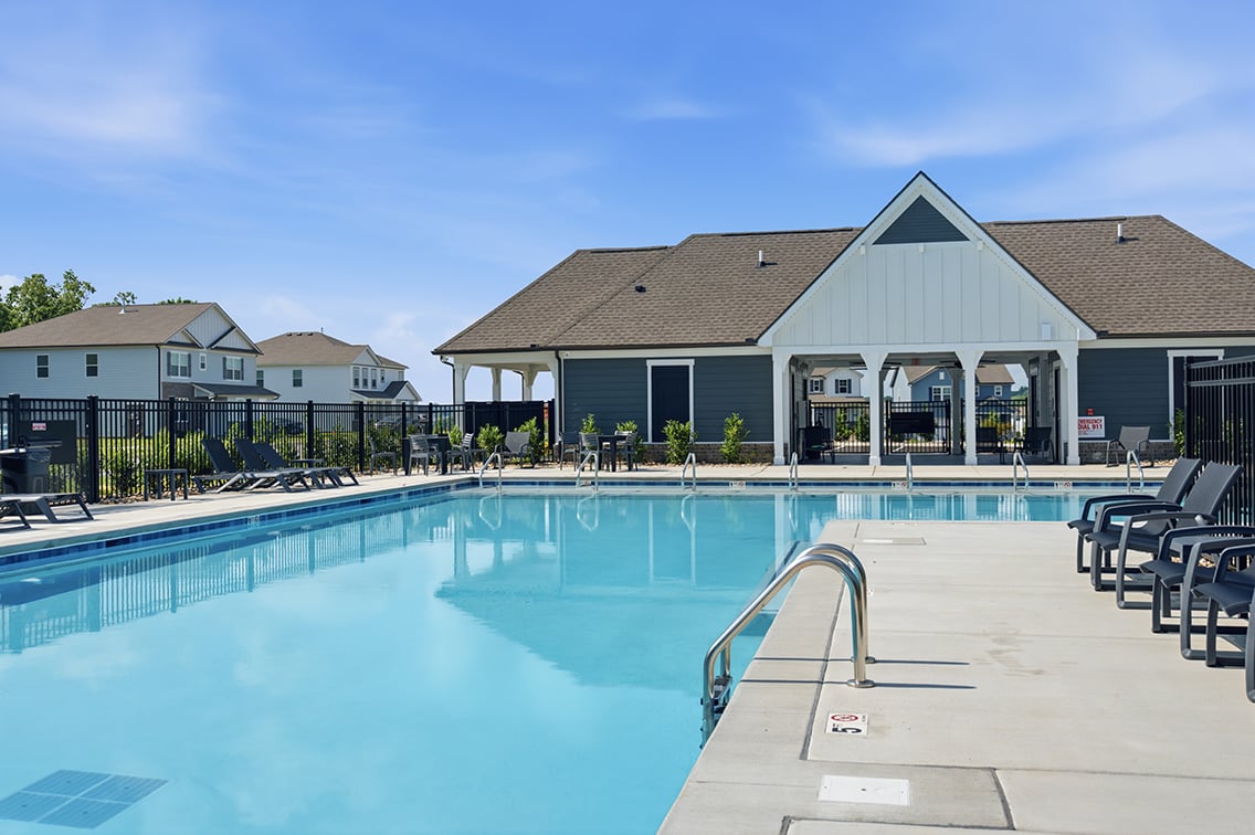 A swimming pool in a backyard.