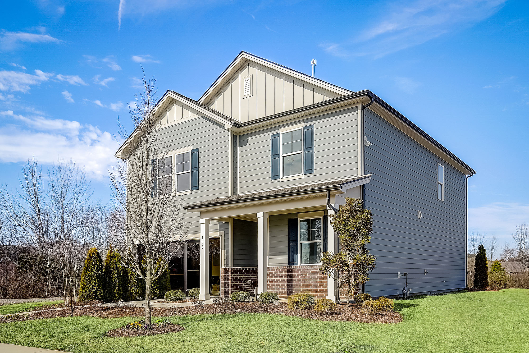 A house with a large front yard.