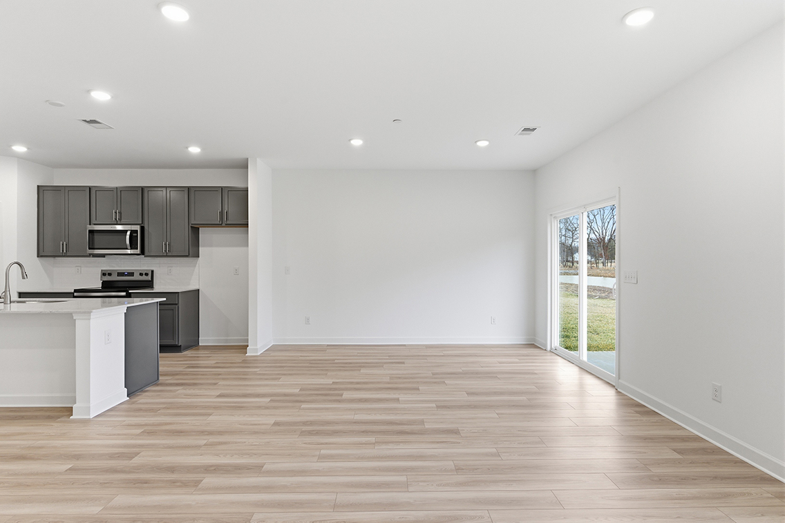 A kitchen with white walls.