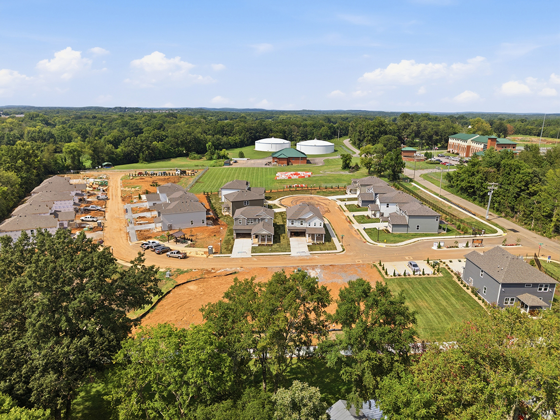 A group of buildings surrounded by trees.